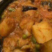 Aloo Bhanta Curry · Eggplant and potatoes cooked in Himalayan style curry sauce.