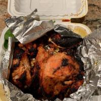 Chicken Tandoori · Chicken with bone marinated in yogurt and spices, broiled in the tandoor over and served siz...