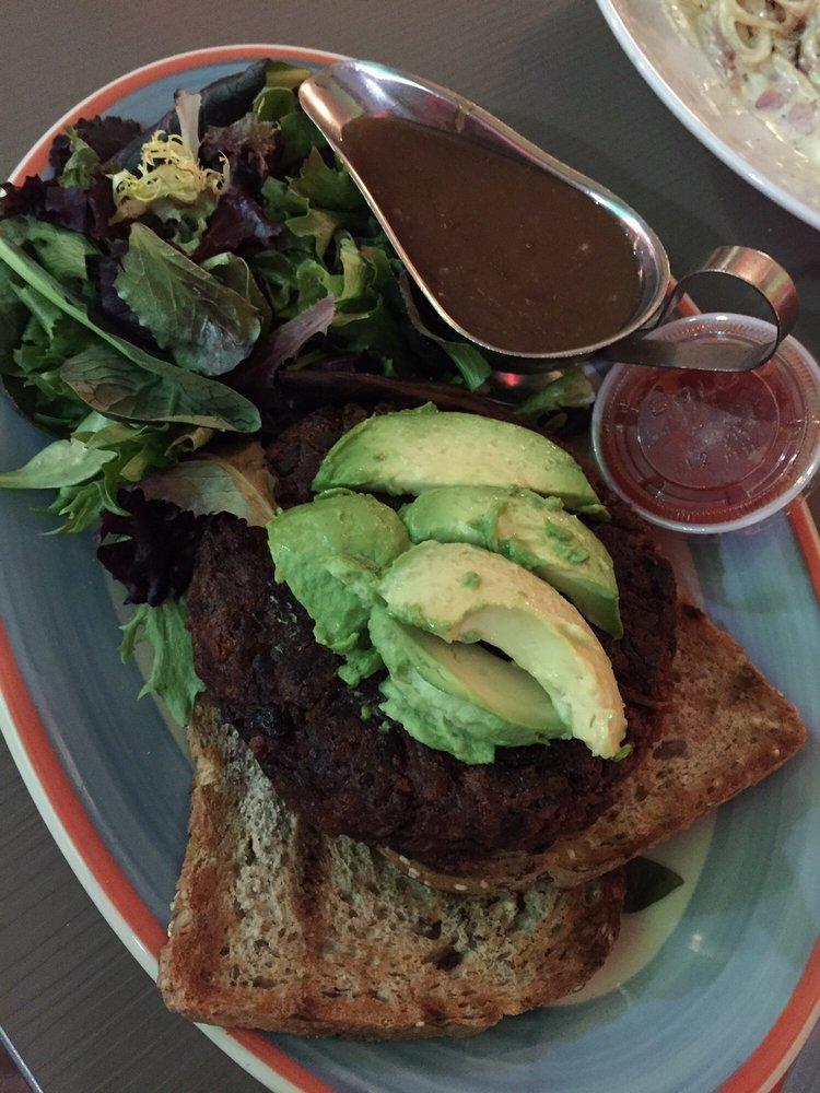 House Made Veggie Burger · Our secret mix of fresh garden veggies and lentils, served with tomato salsa. Deluxe is served french fries, lettuce, tomato, coleslaw and pickle. Served on 7 grain toast