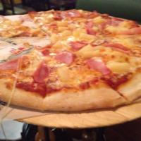 Hawaiian Pizza · With homemade tomato sauce, mozzarella cheese, Canadian bacon, and pineapple.
