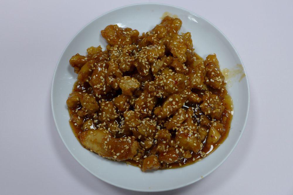 Sesame Chicken · Tender fried chicken sauteed in Szechuan sauce with sesame seeds. Spicy.