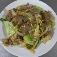 Mongolian Beef · Tender sliced steak sauteed with green onions, white onions & cabbage (also available with w...