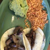 Carne Asada Tacos · 3 corn tortillas filled with grilled steak - comes with pico de gallo, guacamole, beans & rice