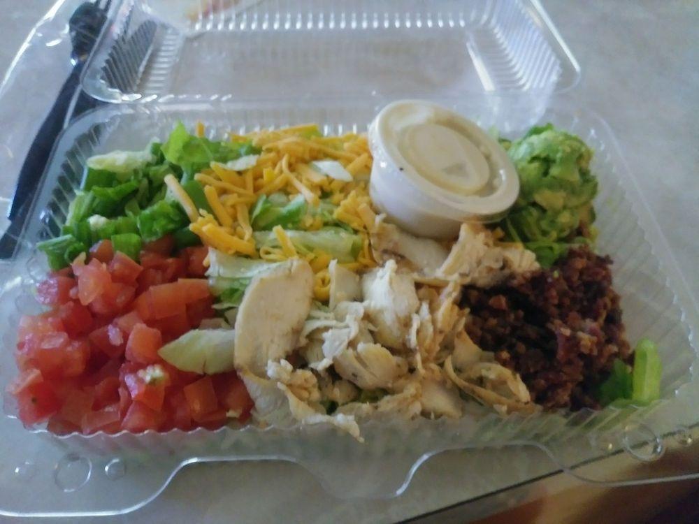 Chopped Salad · Romaine blend, grilled chicken, bacon, bleu cheese, avocado, tomato, green onion, house vinaigrette.