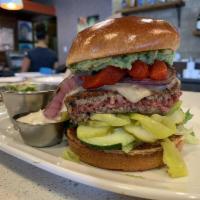 The Impossible Burger · Impossible burger, herbed goal cheese, organic mixed greens, tomatoes, grilled red onions, a...