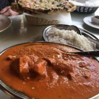 Butter Chicken · Boneless pieces of chicken coocked in the tandoor, then cooked to perfection in a tomato gra...