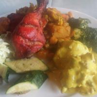 Tandoori Chicken · Half spring chicken marinated with Indian spices and grilled in the tandoor (clay oven). Ite...