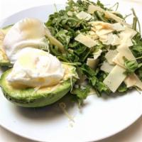 Pregnant Avocado Breakfast · 2 organic poched eggs over Hass avocado, with arugula salad and shaved Parmesan cheese on top.