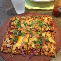 BBQ Chicken Pizza · BBQ sauce, mozzarella cheese, tender chicken, red onions, and fresh cilantro.