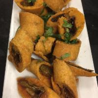 Cut Mirchi · A popular street food savoured widely in Southern India. Stuffed chili peppers are cut and d...