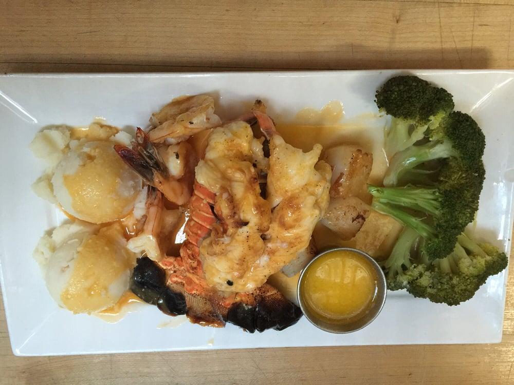 Broiled Twin Lobster Tails · Rabos de lagosta grelhados. Served with choice of rice or potatoes and vegetables. 