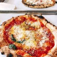 Margherita Pizza · Tomato sauce, fresh mozzarella, extra virgin olive oil, and fresh basil.