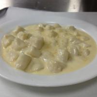 Gnocchi Alfredo · Homemade ricotta gnocchi with creamy alfredo sauce.