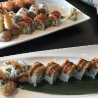 Sunshine Roll · 2 shrimp tempura, cucumber inside, topped with spicy snow crab, crunch, tobiko and sweet may...