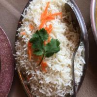 Basmati Rice · Imported Indian long grain rice with a sweet aroma. Cooked with almonds, raisins, cashews, o...