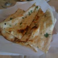 Garlic Nan · Nan sprinkled with garlic. Indian bread baked fresh in clay oven.