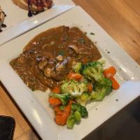 Chicken Marsala · Grilled chicken breast with marsala wine mushrooms and a touch of cream (Comes with a side o...