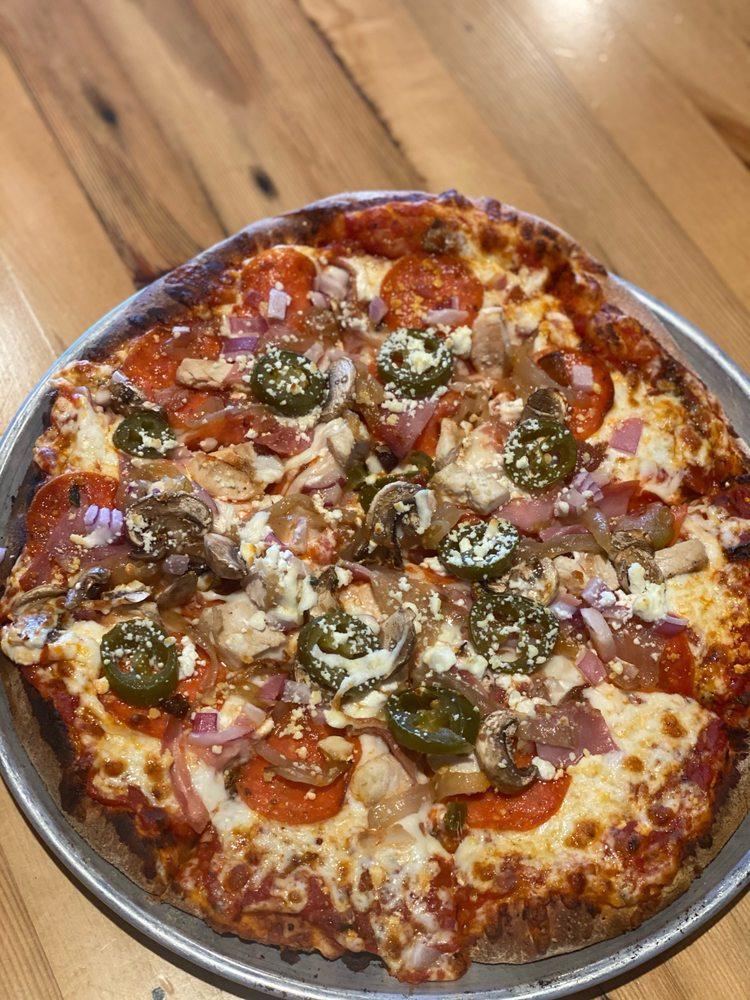 Eatalio Meat Lovers Pizza · Topped with Italian sausage, pepperoni, Canadian bacon, and bacon bits with fresh basil.