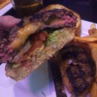Juicy Lucy Burger · Cheddar-jack stuffed patty, lettuce, tomatoes and pickles. These items may contain raw or un...