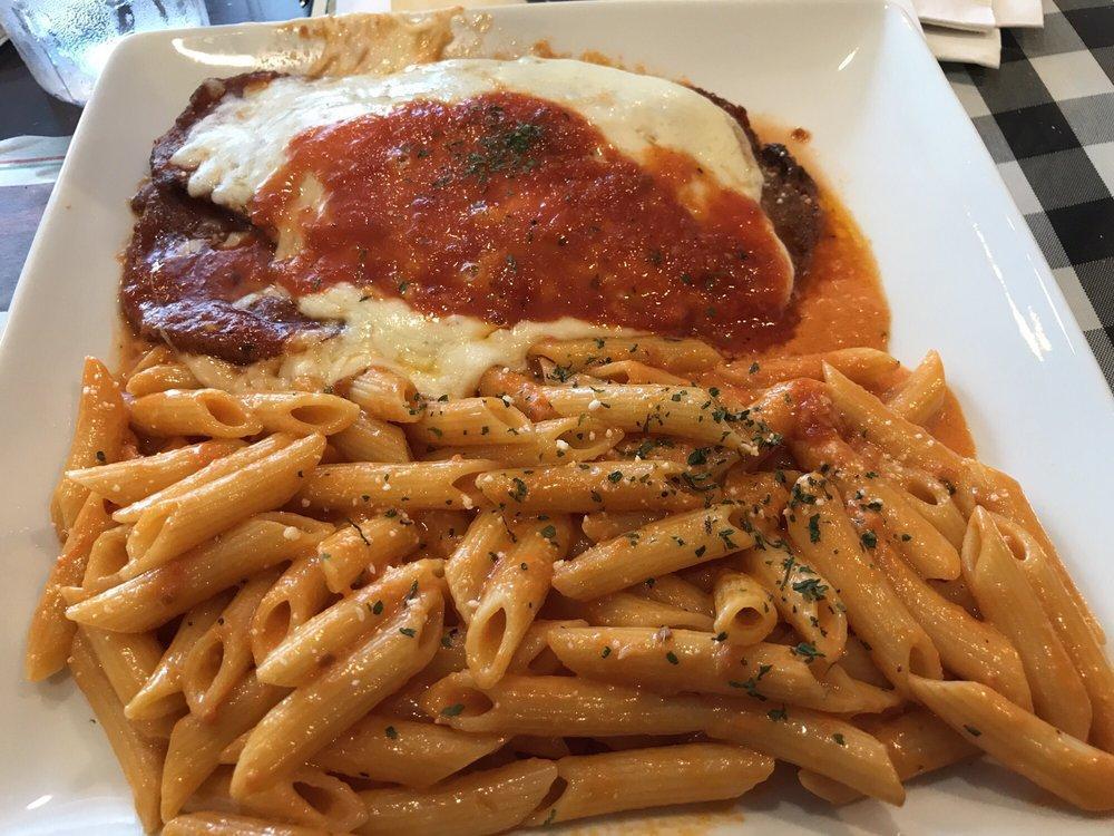 Eggplant Parm · Topped with Parmesan cheese and served with pasta. Includes soup or salad.
