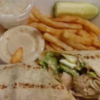 Chicken Caesar Wrap · Grilled chicken, romaine, homemade croutons, hard boiled egg & asiago with caesar dressing. ...
