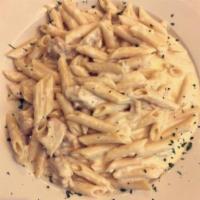 Chicken Alfredo · Sauteed chicken in a creamy Alfredo sauce with penne. And Caesar Salad.