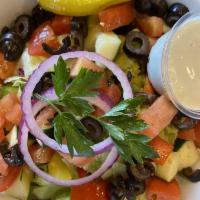 Garden Salad · Carrots, red cabbage, radishes, Roma tomatoes, bell peppers, black olives, onions, pepperonc...