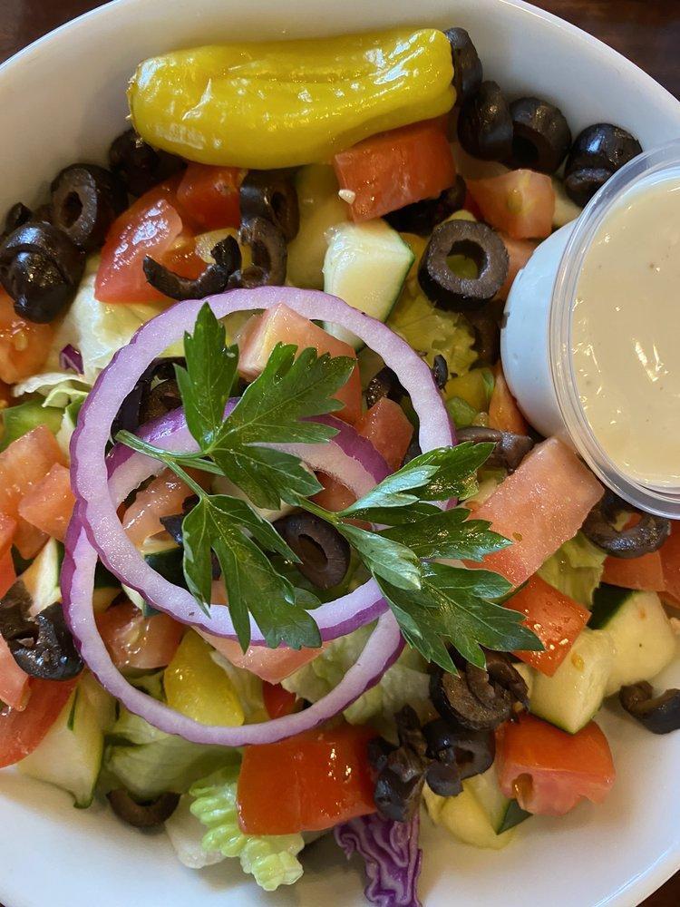 Garden Salad · Carrots, red cabbage, radishes, Roma tomatoes, bell peppers, black olives, onions, pepperoncinis, cucumbers, served with choice of dressing.