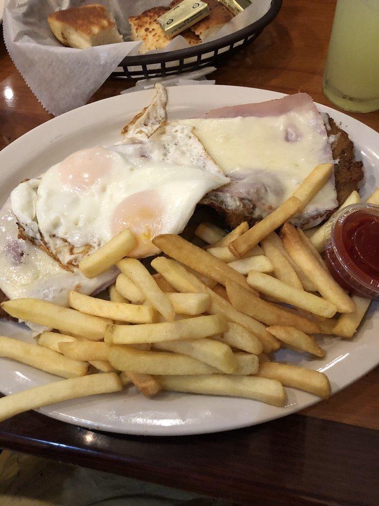 Milanesa Completa · Breaded steak or chicken with ham, cheese, eggs sunny side up and fries.