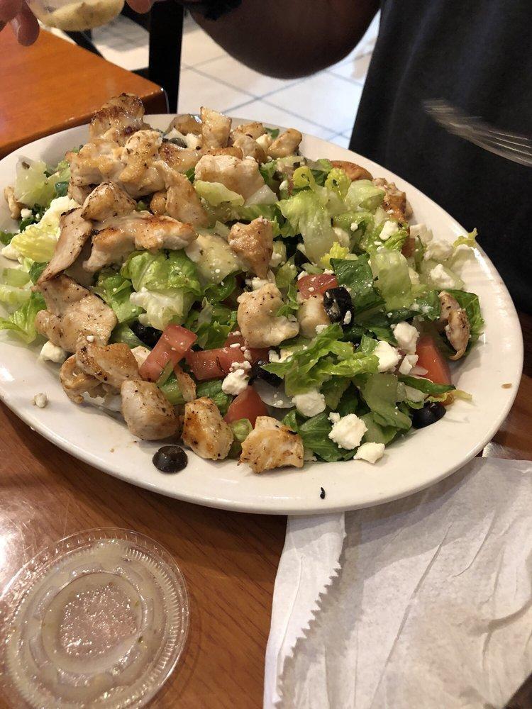 Greek Salad with Chicken · Romaine lettuce, tomatoes, chopped onions, black olives, feta cheese, cucumbers and chicken.
