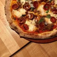 Con Carne Pizza · San marzano tomato sauce, mozzarella, sausage, pepperoni and chorizo.