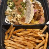 Blackened Fish Tacos · Pickled red onion and pineapple slaw and cilantro aioli. 3 Tacos. Gluten-Friendly (ordered w...
