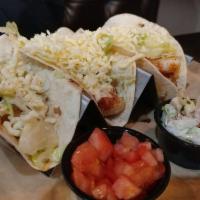 Shrimp Tacos · 3 grilled shrimp tacos served with lettuce, tomato, and our special jalapeno coleslaw.