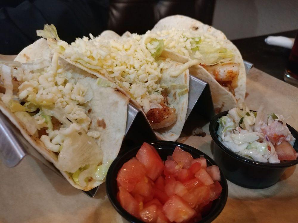 Shrimp Tacos · 3 grilled shrimp tacos served with lettuce, tomato, and our special jalapeno coleslaw.