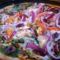 Zilker Love Pizza · Basil pesto sauce with spinach, red onions, marinated tomatoes, feta, black olives, and mozz...