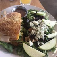 Apple and Blue Cheese Salad · Mixed greens, sliced apples, blue cheese crumbles, dried cranberries, walnuts, and house vin...