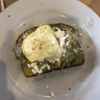 Avocado Toast · Avocado spread on wheat toast with lemon oil, and red pepper flakes, feta cheese, sprouts, a...