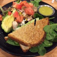 Southwest Salad · Mixed greens, diced tomatoes, roasted corn, black beans, avocado, and feta cheese with chipo...