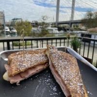 Dock Street Monte Cristo Sandwich · Thinly sliced Black Forest ham, smoked turkey, and spreadable Brie on white bread with homem...