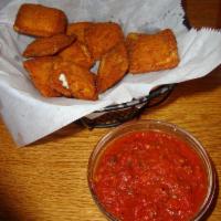 Deep Fried Ravioli · Breaded cheese ravioli's, meat sauce. Extra sauce for an additional charge.