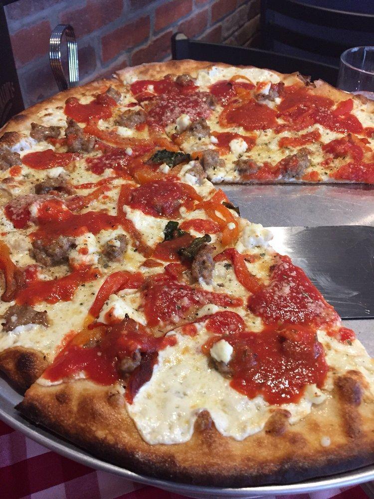Brooklyn Bridge Pizza · Oven-roasted red peppers, creamy ricotta cheese and hand pinched Italian sausage, a top our traditional pizza.