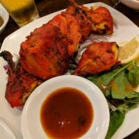 Tandoori Chicken Wings · Marinated over night with herbs and spices, cooked in clay oven.