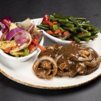 Hamburger Steak · Served with sauteed mushrooms, onions, and brown gravy over mashed potatoes with a choice of...