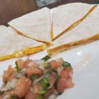Cheese Quesadilla · Big Flour tortilla filled with Follow your Heart cheese and a side of pico de gallo.