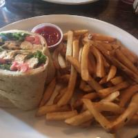 Grilled Chicken Wrap · Smoked Mozzarella, Greens, Tomato & Spicy Sour Cream, with Fries or Mixed Greens