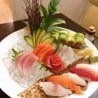 Sashimi Platter · With white rice, 16 pieces of chef's selected sashimi with exotic presentation. Comes with c...