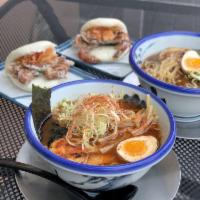 Yuzu Shio Ramen · Shio tare, chicken broth, yuzu, bamboo, egg, chashu pork, endive, fried garlic, and nori.