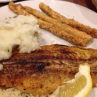 Catfish · 2 large filets grilled with blackened seasonings or deep fried with a cornmeal batter.