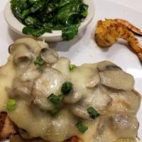 Smothered Chicken · Marinated grilled chicken, covered with sauteed mushrooms, onions, Jack cheese, served on a ...