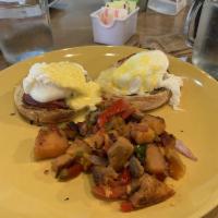 Eggs Benedict · Two poached eggs over an English muffin, Canadian bacon and Hollandaise sauce. Served with
s...